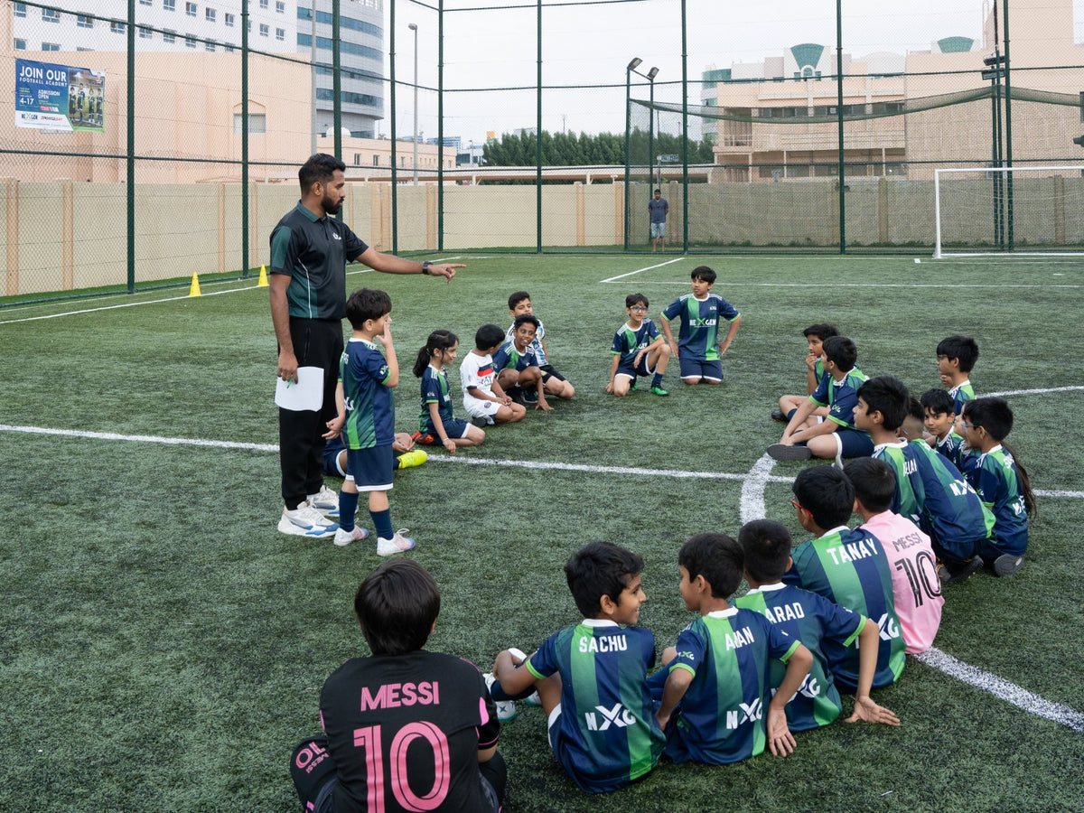 Young players gathered around their coach