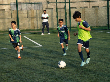 NEXGEN Grassroots players chasing the ball