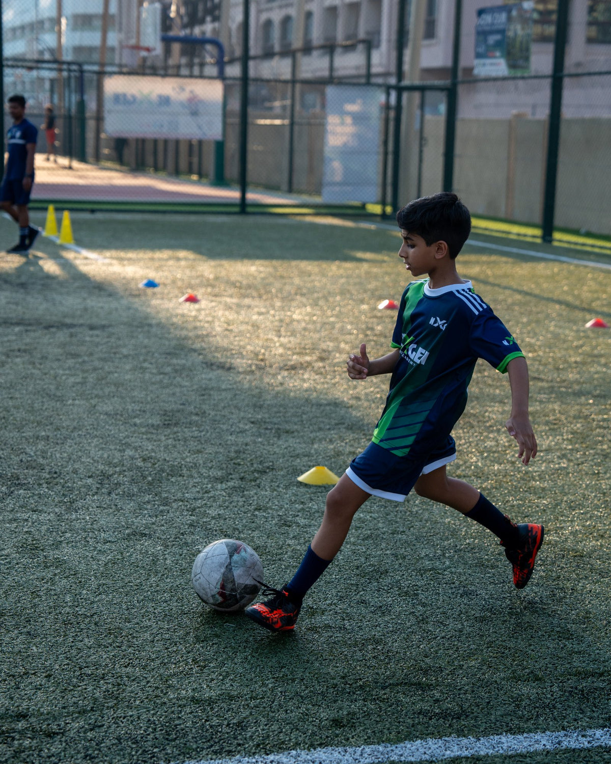 NEXGEN academy player dribbling at speed